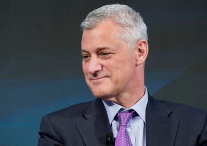 FILE PHOTO: Bill Winters, Group Chief Executive Officer of Standard Chartered Bank, smiles during the World Economic Forum (WEF) annual meeting in Davos, Switzerland January 24, 2018.  REUTERS/Denis Balibouse