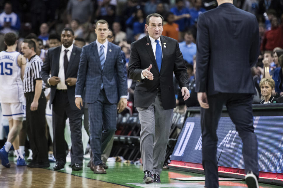 Duke coach Mike Krzyzewski prepares to shake hands with North Dakota State coach David Richman after a first-round game in the NCAA men's college basketball tournament Friday, March 22, 2019, in Columbia, S.C. Duke defeated North Dakota State 85-62. (AP Photo/Sean Rayford)