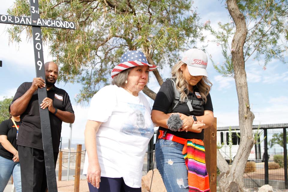 Pat Benavides (left), whose husband was among those murdered on Aug. 3, 2019, holds hands with Betty Camargo of Border Network for Human Rights during a remembrance ceremony Thursday, Aug. 3, 2023, at Ponder Park for the 23 victims of the racist mass shooting.