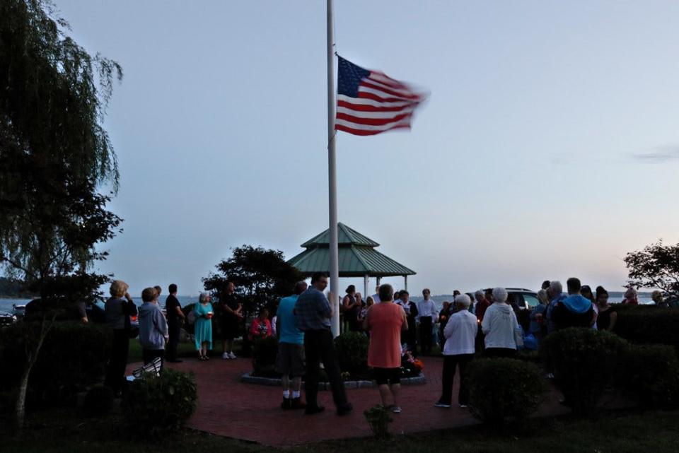 People gather around the 9/11 Memorial in Warwick on Sept. 11, 2018, to mark the 17th anniversary of the terror attack.