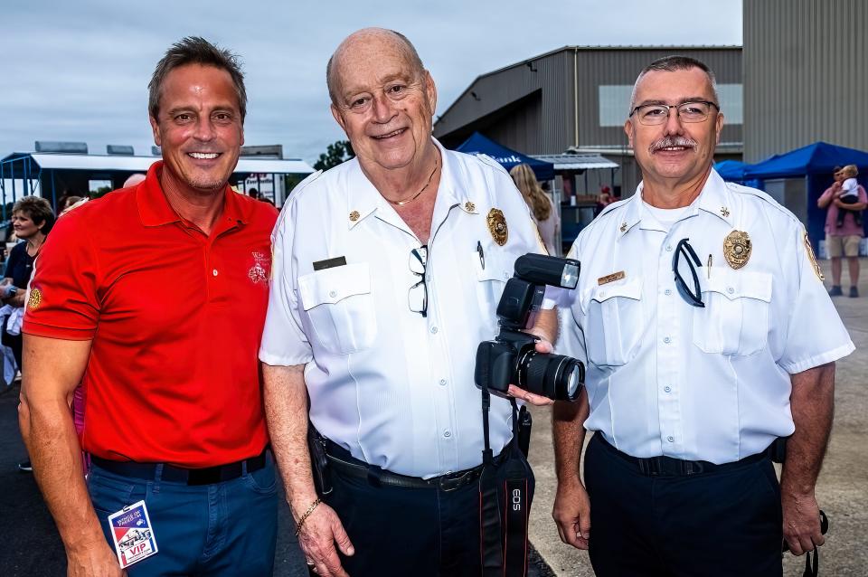 WKRN's Neil Orne, left, stands with Smyrna Fire Rescue Department Chief Bill Culbertson and Assistant Chief Ferris Belcher at the Wings of Freedom Fish Friday. The event was sponsored by the Rotary Club of Smyrna and held Sept. 10, 2022, at the Smyrna Airport.