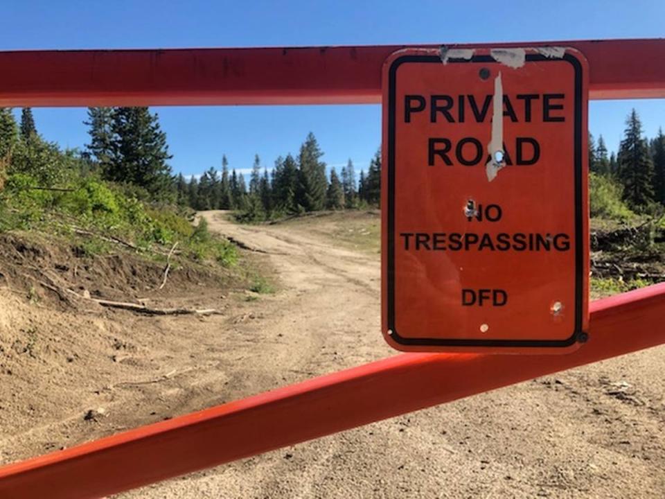 In this 2019 file photo, a sign reading, “Private road. No trespassing,” is attached to a gate across Forest Service road 645 where it leaves the Boise National Forest and enters private land. The land is owned by DF Development, a Wilks brothers company. The brothers have recently listed some properties on LandTrust.com to allow paid access.