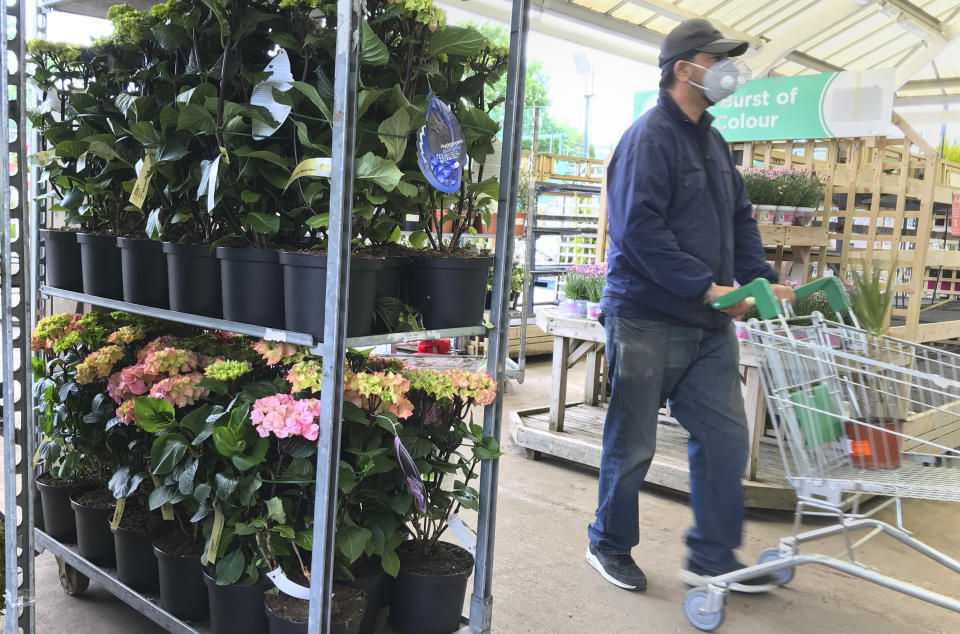A custiomer shops in a garden and DIY centre. Photo: Kirsty Wigglesworth/AP