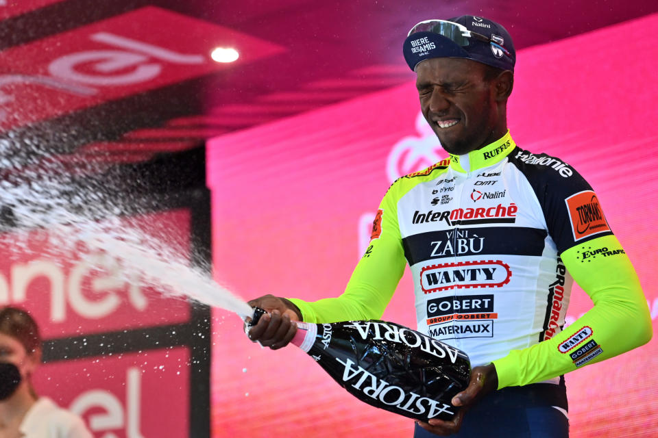 Eritrea's Biniam Girmay celebrates on the podium after winning the 10th stage of the Giro D'Italia cycling race from Pescara to Jesi, Italy, Tuesday, May 17, 2022. (Massimo Paolone/LaPresse via AP)