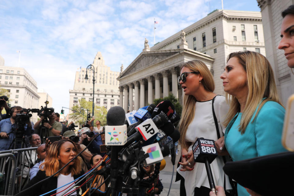 Jennifer Araoz, 32, who alleges that Jeffrey Epstein raped her in his New York townhouse in 2002 when she was only 14, speaks to the media with her lawyer after leaving the New York court house on August 27, 2019. | Spencer Platt—Getty Images