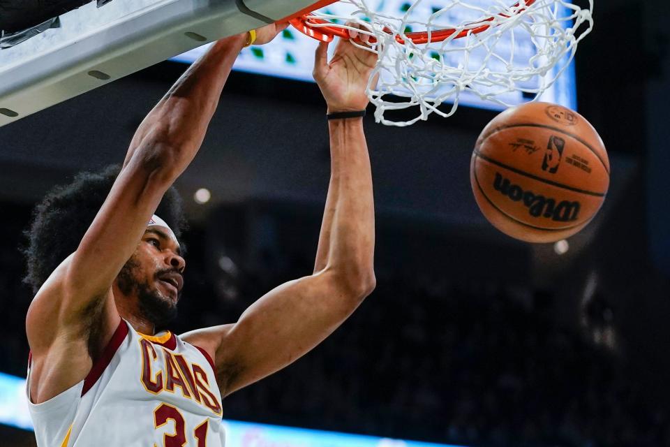 Cavaliers center Jarrett Allen dunks during the first half of a 112-104 loss to the Milwaukee Bucks on Monday night. [Morry Gash/Associated Press]