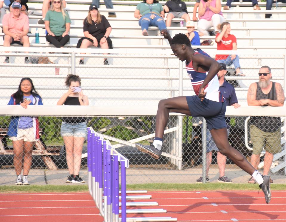 Wol Machteng from the Utica Academy of Science approaches his last jump on the way to a win in his 400-meter race at Section III's Class C-1 track and field championship.