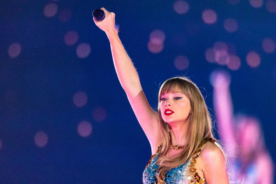 Taylor Swift reacts after finishing a song during her first sold-out concert of three nights at AT&T Stadium in Arlington on Friday, March 31, 2023.