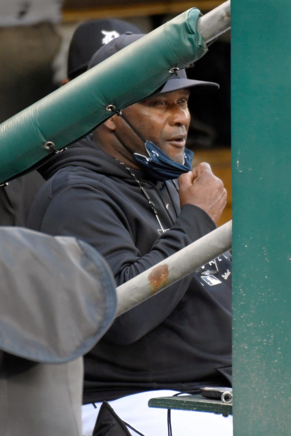 Detroit Tigers manager Lloyd McClendon takes off his face mask to eat a snack in the first inning against the Cleveland Indians, Saturday, Sept. 19, 2020, in Detroit.