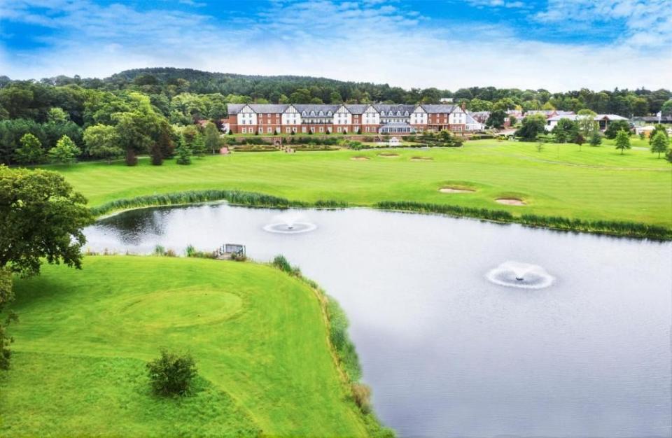 a golf course with a pond