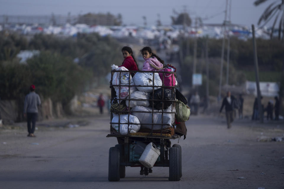 Palestinians who flee from Khan Younis from Israeli ground and air offensive on the Gaza Strip arrive in Rafah, southern Gaza, Monday, Jan. 22, 2024. (AP Photo/Fatima Shbair)