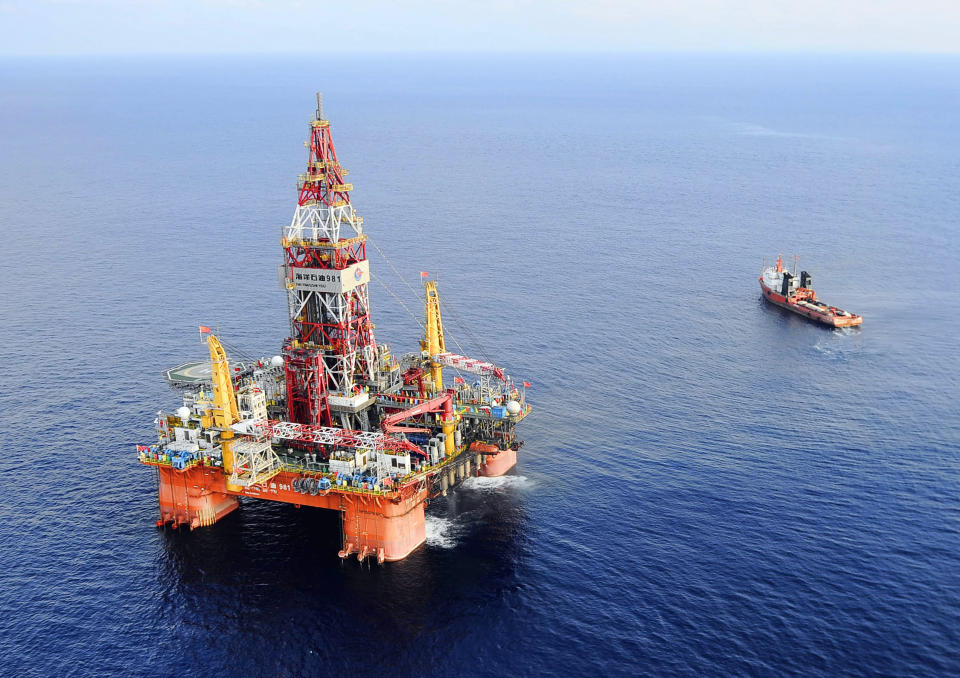 FILE - In this May 7, 2012 file photo released by China's Xinhua News Agency, CNOOC 981, the first deep-water drilling rig developed in China, is pictured at 320 kilometers (200 miles) southeast of Hong Kong in the South China Sea. Vietnam warned China on Tuesday, May 6, 2014, that it would take all necessary measures to defend its interests in the South China Sea if Beijing does not remove the large oil rig from waters claimed by both countries. (AP Photo/Xinhua, Jin Liangkuai, File) NO SALES