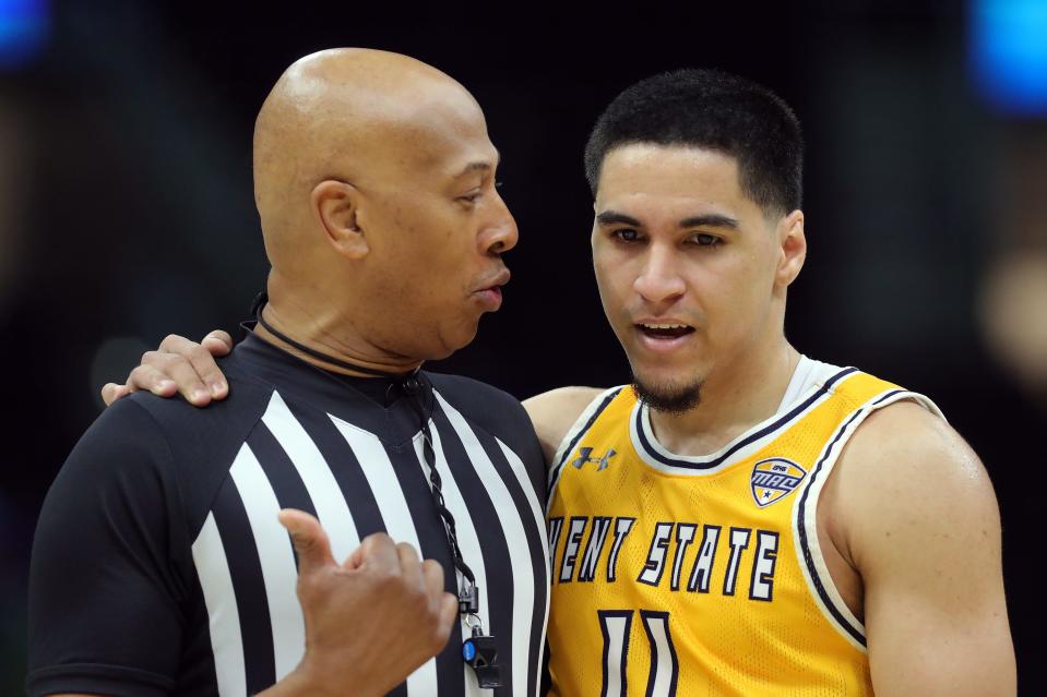 Kent State's Giovanni Santiago gets an explanation on a call from an official during the second half of Friday's MAC Tournament semifinal against Bowling Green.