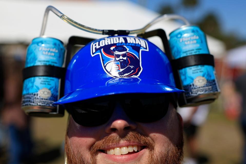 Sam Cox of St. Augustine is seen wearing a beer hat during the inaugural Florida Man Games Saturday, Feb. 24, 2024 at Francis Field in St. Augustine, Fla. Hundreds turned out to witness the Floridian Olympic-style events. [Corey Perrine/Florida Times-Union]