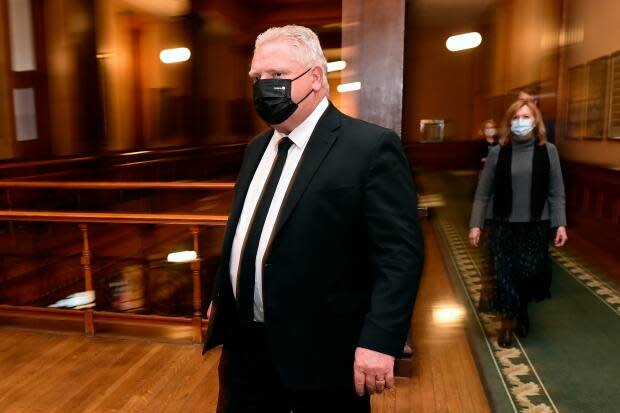 Ontario Premier Doug Ford and Health Minister Christine Elliott walk to a news conference at Queen's Park on Friday, April 16. Both have written to the federal government asking for stricter measures at borders.