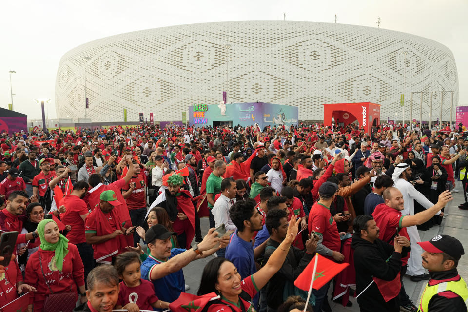 FILE - Fans arrive at the stadium before the World Cup quarterfinal soccer match between Morocco and Portugal, at Al Thumama Stadium in Doha, Qatar, Saturday, Dec. 10, 2022. (AP Photo/Ebrahim Noroozi, File)