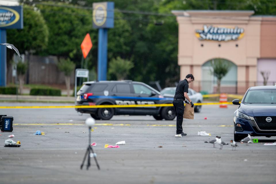 The Tallahassee Police Department investigates a mass shooting that occurred overnight at the Parkway Center shopping plaza Sunday, May 12, 2024.