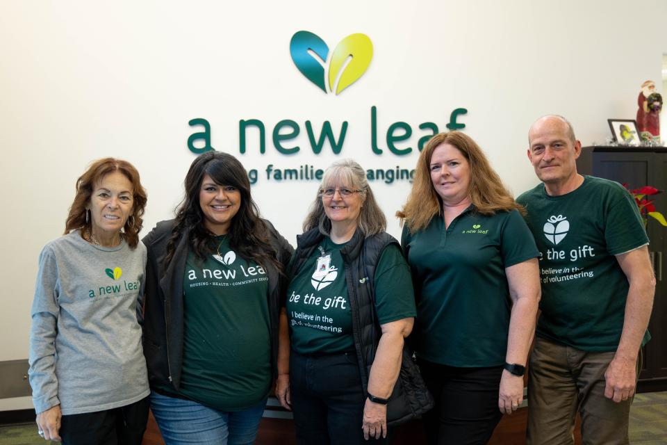 A New Leaf volunteers and staff pose for a picture at La Mesita Family Homeless Shelter on Dec. 28, 2022, in Mesa.