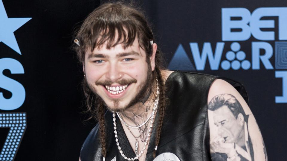 LOS ANGELES, CALIFORNIA - JUNE 25, 2017: Post Malone attends the 2017 BET Awards Red Carpet at the Microsoft Theater in Los Angeles, California on June 25, 2017.