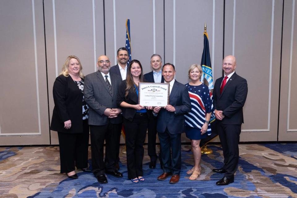 Leaders from Lockheed Martin and the Defense Counterintelligence and Security Agency celebrate Fort Worth’s Cogswell Award win at an awards ceremony on June 7.