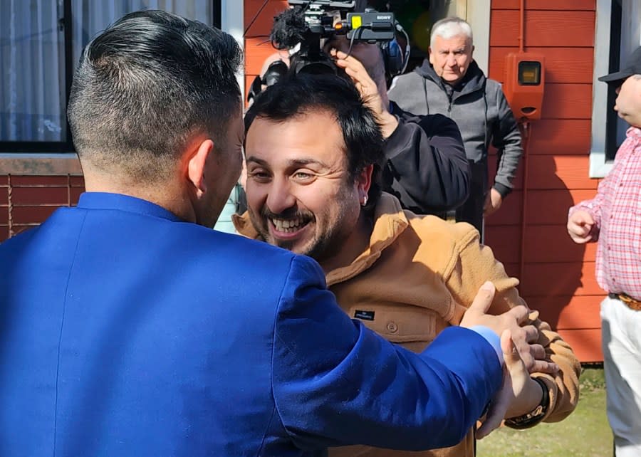 In this image provided by Constanza Del Rio/Nos Buscamos, Jimmy Thyden, left, meets his brother Jonathan Gonzalez for the first time in Valdivia, Chile on Aug. 17, 2023. For months Thyden has been on a journey to uncover the mysteries of his counterfeit adoption, and to reconnect with his biological mother, brothers and sister. (Constanza Del Rio/Nos Buscamos via AP)