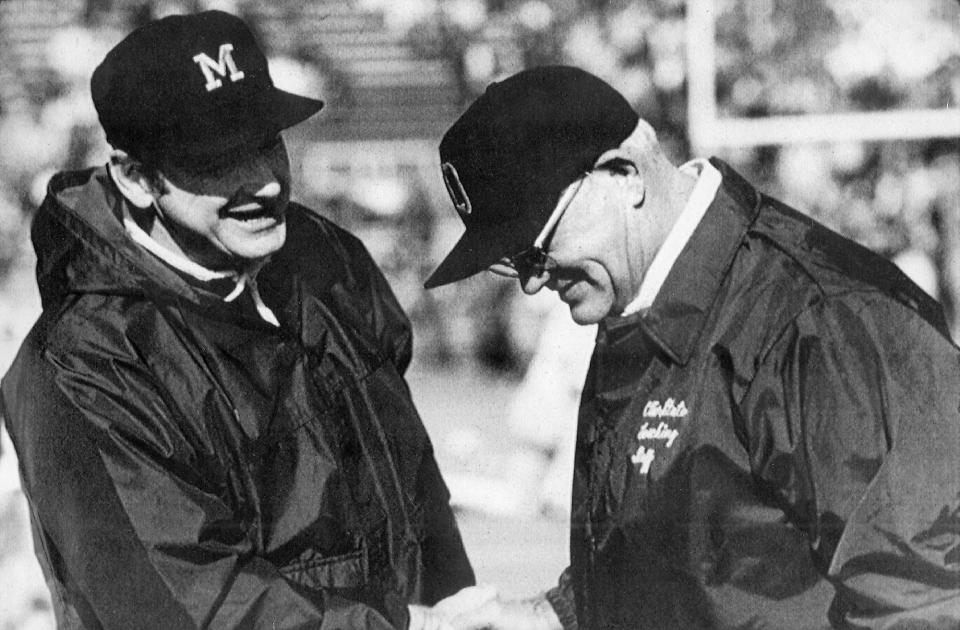 FILE - Michigan football coach Bo Schembechler, left, meets with Ohio State coach Woody Hayes in this file photo, location unknown. No. 2 Ohio State and No. 3 Michigan have a chance to add to The Game lore. If highly anticipated matchup goes as expected on Saturday in the Horseshoe, it will join the long lore of memorable games in a series that dates to 1897. (AP Photo, File)