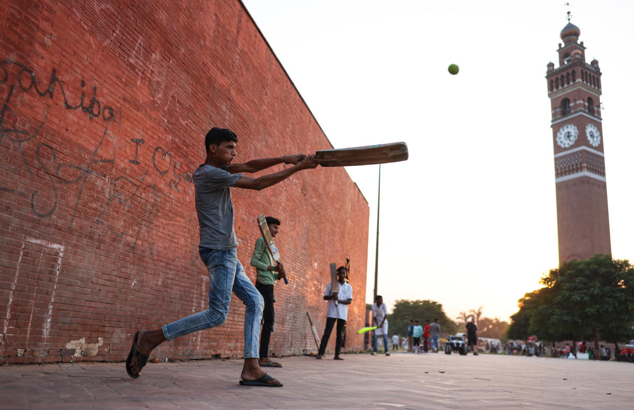 Locals playing cricket in Lucknow, India, over the weekend. (Matthew Lewis/ICC via Getty Images)