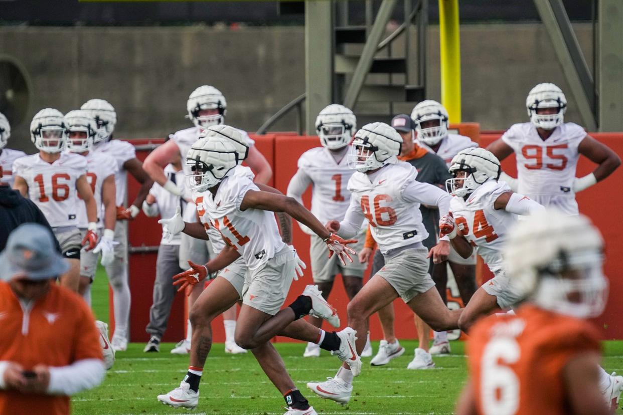 Texas players go through drills during spring practice at Denius Fields on March 19. The Longhorns' annual Orange-White spring game will be April 20 at Royal-Memorial Stadium.