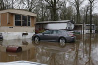 Standing floodwater from the Pearl River surrounds a number of mobile homes in the Harbor Pines community in Ridgeland, Miss., Tuesday, Feb. 18, 2020. Some residents are allowed to enter their homes in the non-flooded portion of the mobile home community to retrieve clothing and prescriptions. (AP Photo/Rogelio V. Solis)