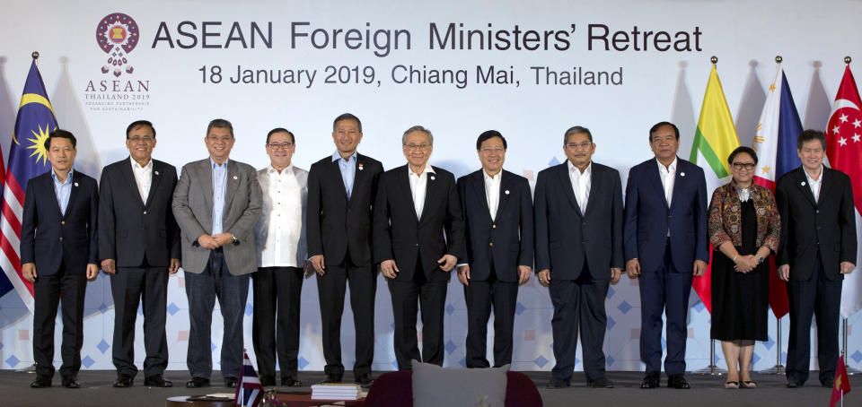 Foreign ministers of the Association of Southeast Asian Nations (ASEAN) pose for a group photo during the ASEAN Foreign Ministers' retreat in Chiang Mai, Thailand, Friday, Jan. 18, 2019. They are from left to right, Laos' Saleumxay Kommasith, Myanmar's Kyaw Tin, Malaysia's Saifuddin Abdullah, Philippines Foreign Affaires Secretary Teodoro Locsin Jr., Singapore's Vivian Balakrishnan, Thailand's Don Pramudwinai, Vietnam's Phạm Binh Minh, Brunei Second Minister of Foreign Affaires and Trade Erywan Yusof, Cambodia's Prak Sokhon, Indonesia's Retno Marsudi and ASEAN Secretary-General Dato Lim Jock Hoi. (AP Photo/Gemunu Amarasinghe)