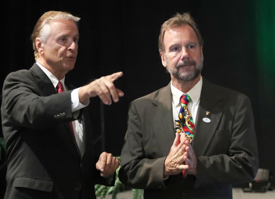 Frank Bruno former county chair talks with Volusia County Chair Jeff Brower, Tuesday February 28, 2023 during the State of the County address at the Ocean Center.