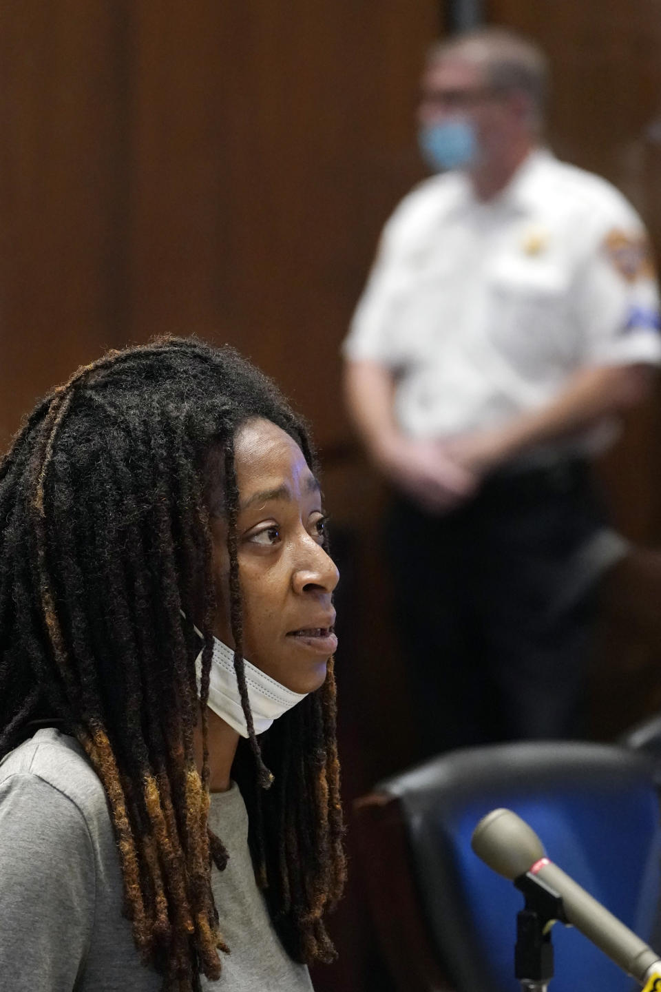 Tiffany Taylor, left, who survived an attack by Khalil Wheeler-Weaver speaks during his sentencing in Newark, N.J., Wednesday, Oct. 6, 2021. Wheeler-Weaver, a New Jersey man who used dating apps to lure and kill three women five years, ago was sentenced Wednesday to 160 years in prison after a trial in which it was revealed that friends of one victim did their own detective work on social media to ferret out the suspect. (AP Photo/Seth Wenig, Pool)
