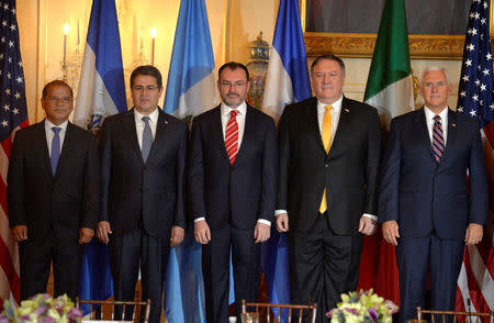 (L-R) El Salvador's Vice President Oscar Ortiz, Honduras' President Juan Orlando Hernandez, Mexico's Foreign Minister Luis Videgaray, U.S. Secretary of State Mike Pompeo and Vice President Mike Pence pose for a group photo prior to the start of the Second Conference on Prosperity and Security in Central America, which also includes Guatemala at the State Department, in Washington, U.S., October 11, 2018. REUTERS/Mike Theiler