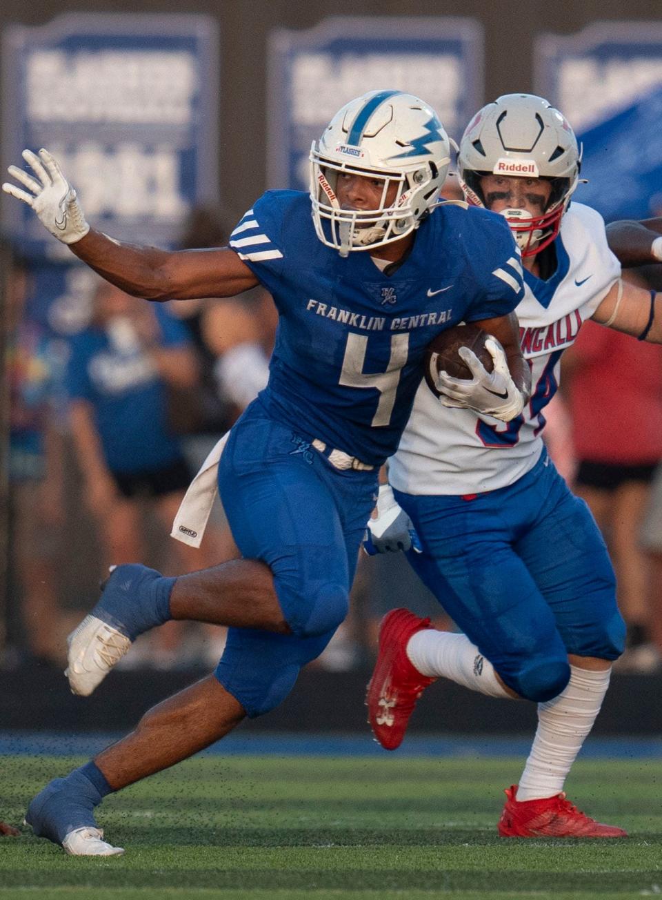 Franklin Central Flashes Jayon Harvey (4) on the carry during the game between against Roncalli Royals Friday, Aug. 25, 2023 at Franklin Central High School in Indianapolis. Franklin Central Flashes defeated Roncalli Royals 20-6.