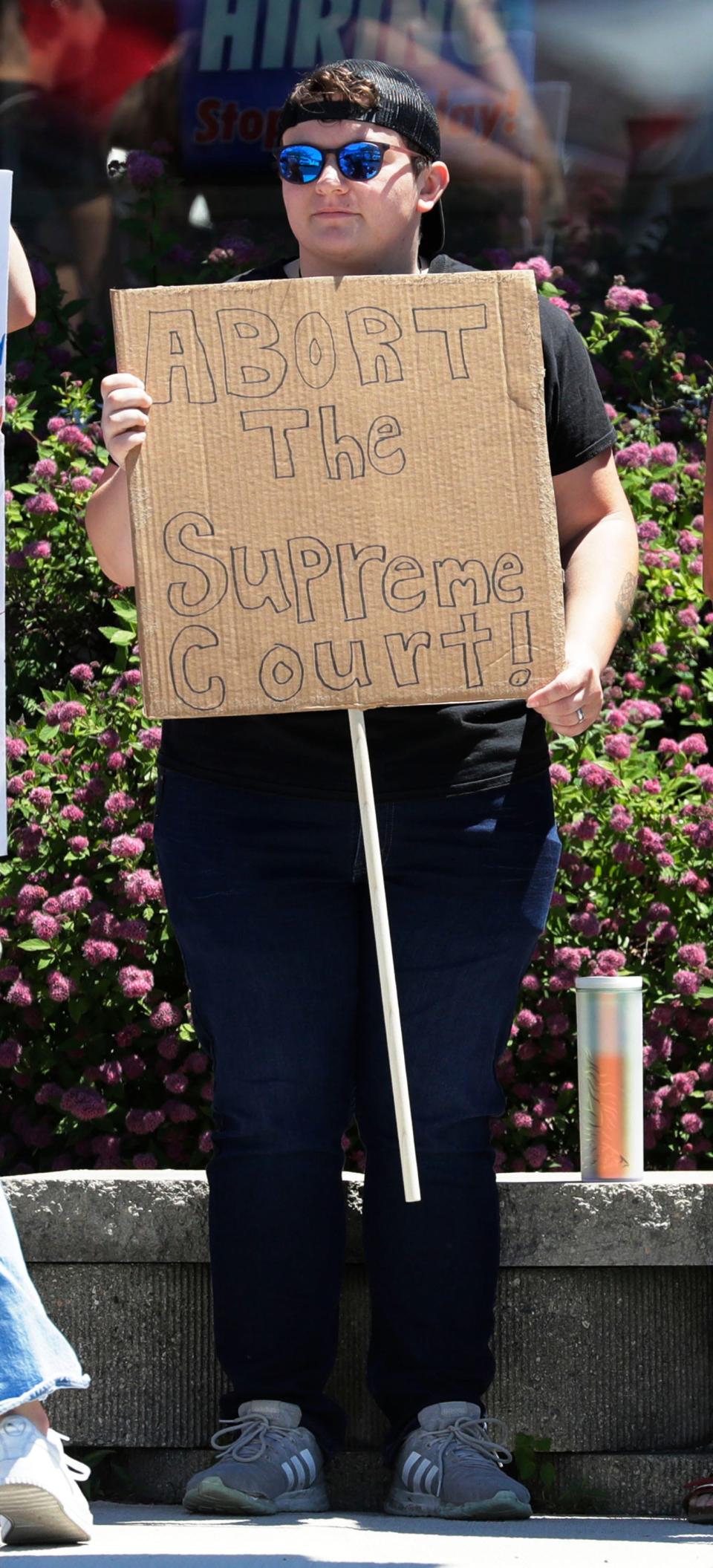 A sign holder disagrees with the Spreme Court during the Rally for Reproductive Freedom at 14th and Erie Avenue, Sunday, June 26, 2022, in Sheboygan, Wis.  The rally, sponsored by the Sheboygan Abortion Rights Coalition, is a response to the United States Supreme Court decision which reversed Roe v. Wade this past Friday.