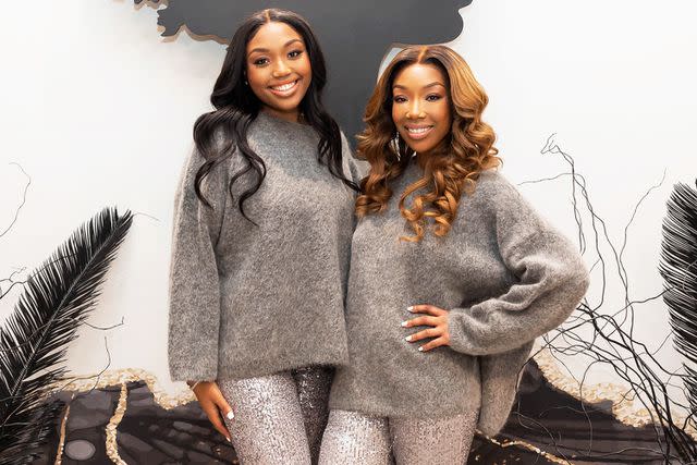 <p>Natasha Campos/Getty</p> Sy'Rai Smith and Brandy Norwood in Los Angeles in December 2022