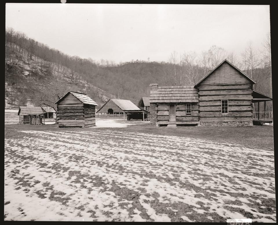 What is now the Mountain Farm Museum near the Oconaluftee entrance to the national park as captured by Henry Lix. At this location and elsewhere in the park by the mid-1950s, park visitors could peruse racks of informational books, postcards, and brochures—some of them printed by the Great Smoky Mountains History Association that Henry Lix helped to create.