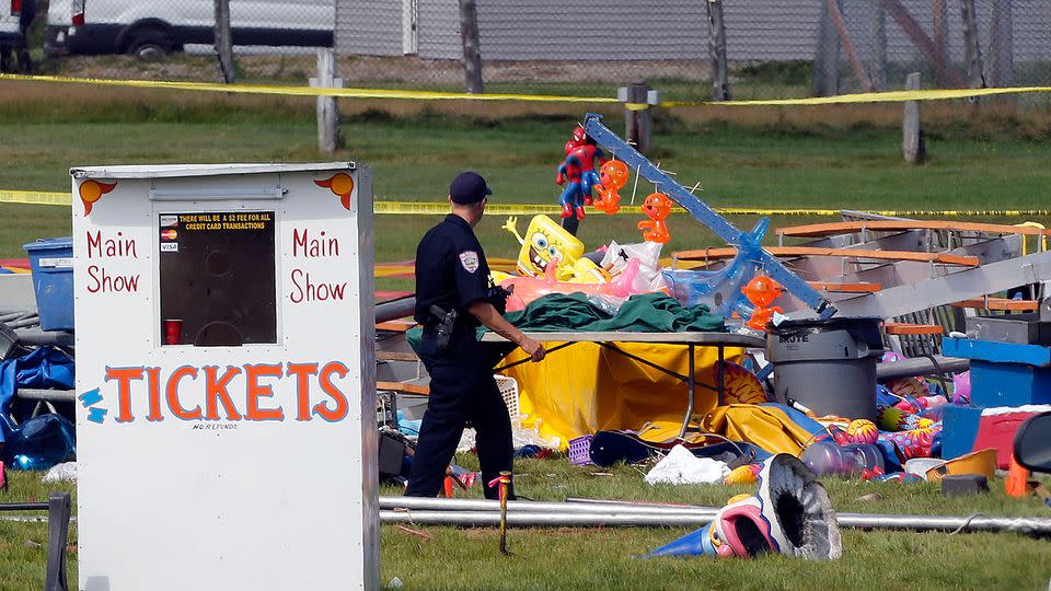 Investigators inspect the site of a circus tent that collapsed during a show by the Walker Brothers International Circus at the Lancaster Fair grounds, killing a father and daughter. Photo: AP Photo/Jim Cole