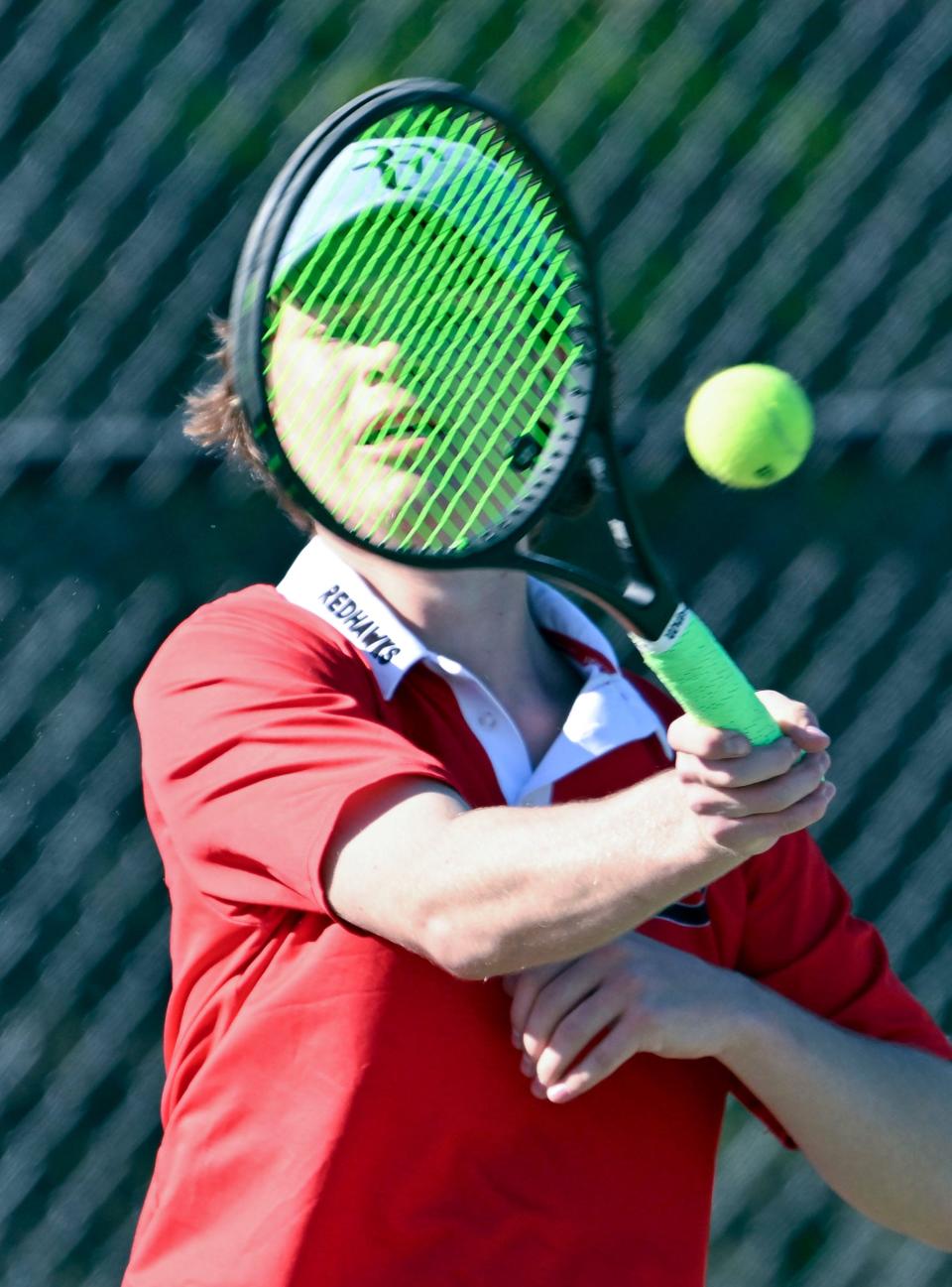 Barnstable number two singles player Eric Arabadzhiev looks though his racket returning a forehand at Martha's Vineyard on Friday, May 5, 2023.