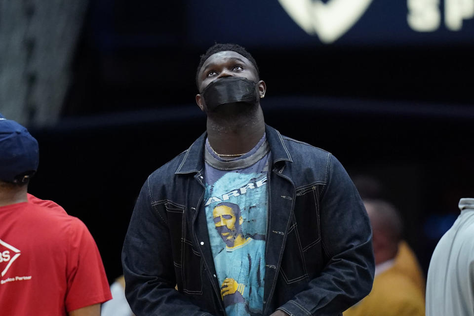 New Orleans Pelicans forward Zion Williamson looks up at the scoreboard in the first half of an NBA basketball game against the Washington Wizards in New Orleans, Wednesday, Nov. 24, 2021. (AP Photo/Gerald Herbert)