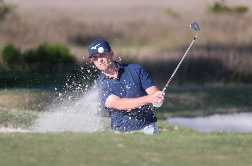 Former Georgia Southern golfer Steven Fisk blasts out of a bunker on the 18th hole during the final round of the Korn Ferry Club Car Championship at the Landings Club Deer Creek Course on Sunday, April 7, 2024.