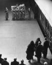 <p>King George VI dies on February 6. Princess Elizabeth becomes Queen Elizabeth II, with Queen Elizabeth taking the name "Queen Mother" to avoid confusion between the two. Here, they watch the funeral proceedings. </p>