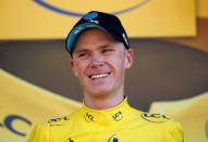 Cycling - Tour de France cycling race - The 184-km (114,5 miles) Stage 8 from Pau to Bagneres-de-Luchon, France - 09/07/2016 - Team Sky rider Chris Froome, new yellow jersey leader, reacts on the podium after winning the stage. REUTERS/Juan Medina