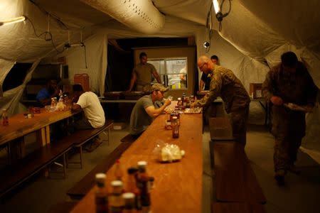 Members of U.S. Army have their dinner at a military base southwest of Mosul, Iraq April 28, 2017. Picture taken April 28, 2017. REUTERS/Suhaib Salem