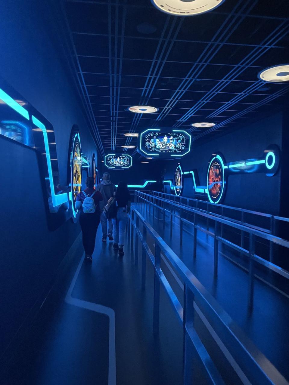 tron light cycle run at walt disney world line queue inside the ride