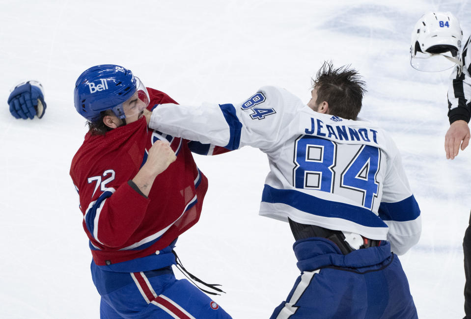 Montreal Canadiens' Arber Xhekaj (72) and Tampa Bay Lightning's Tanner Jeannot (84) fight during the second period of an NHL hockey game, Tuesday, Nov. 7, 2023 in Montreal. (Christinne Muschi/The Canadian Press)