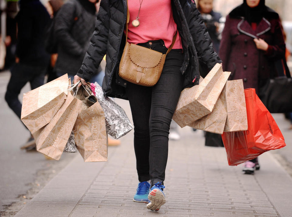 EMBARGOED TO 0001 FRIDAY OCTOBER 22 File photo dated 06/12/11 of a person carrying shopping. Consumer confidence has dropped for the third month in a row in a worrying turn for retailers in the build-up to Christmas. Issue date: Friday October 22, 2021.