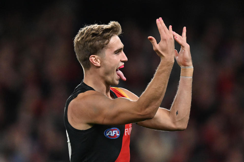 MELBOURNE, AUSTRALIA - MAY 11: Matt Guelfi of the Bombers celebrates kicking a goal during the round nine AFL match between Essendon Bombers and Greater Western Sydney Giants at Marvel Stadium, on May 11, 2024, in Melbourne, Australia. (Photo by Daniel Pockett/AFL Photos/via Getty Images)