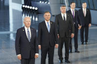 President Joe Biden and other NATO heads of the states and governments pose for a family photo during the NATO summit at the Alliance's headquarters, in Brussels, Belgium, Monday, June 14, 2021. (Kevin Lamarque/Pool via AP)