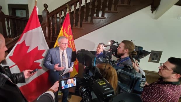 Premier Blaine Higgs tells reporters the all-party committee, made up of cabinet ministers and the four party leaders, began meeting late in the afternoon about closing schools, and he announces its unanimous decision a few hours later. (Photo: Shane Fowler/CBC News - image credit)